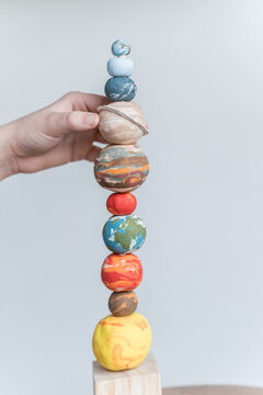 space planet stacking toy with hand 