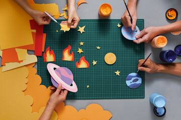 Multi-colored paper crafts on the cutting mat and scrapbooking