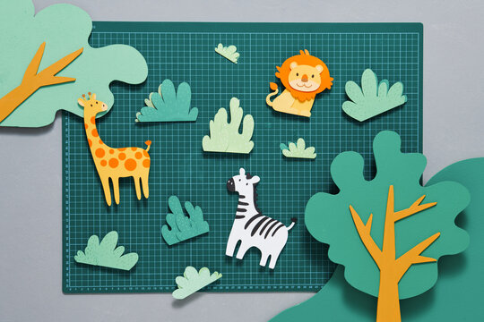 Giraffe, zebra, lion made from paper in art project
