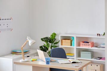 Modern workplace with laptop on table