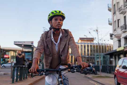 Bicycle Commute, Young Black Woman Riding A Bike In The City