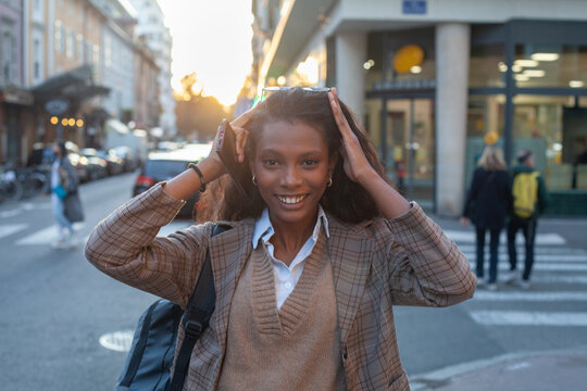 happy young business woman, portrait  looking at camera on the street