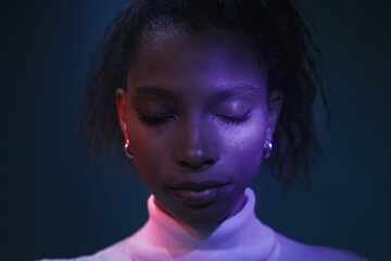 futuristic female portrait,  closed eyes, neon light , face close up