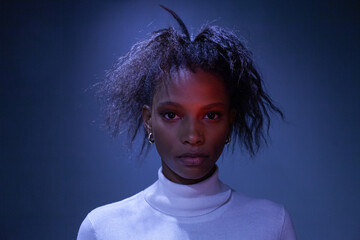 portrait, beautiful confident black woman, female face in neon light 