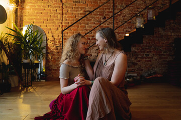 Two Boho Women In Loving Pose 