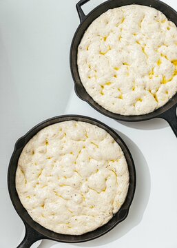 Dough rising in cast iron pans