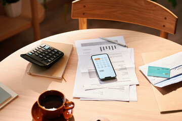 Financial documents for paying bills on table