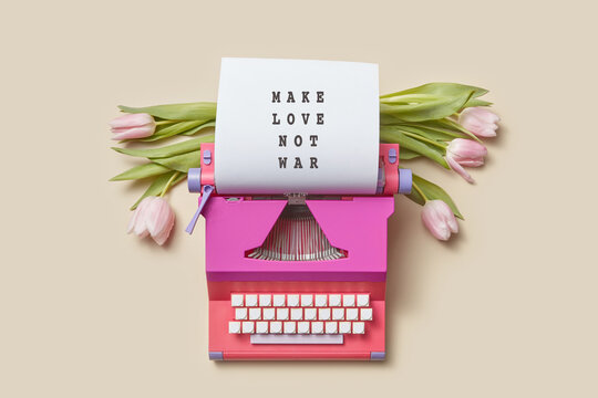 Typewriter with Make Love not War text on paper