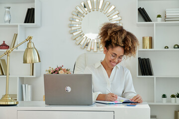 Shot of beautiful business woman working with laptop 