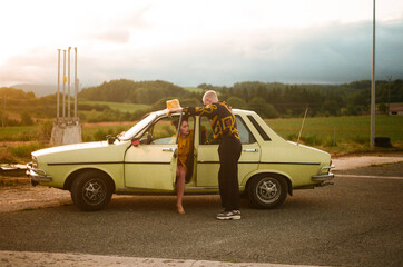 Couple in a vintage car OUTDOORS