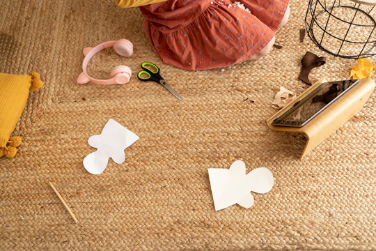 Kid making puppets watching tutorial