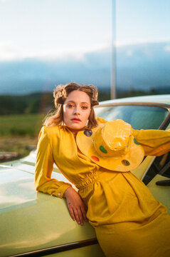 Portrait of a girl dessing in yellow vintage clothes