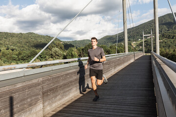 Young Boy Running in Mountain Resort