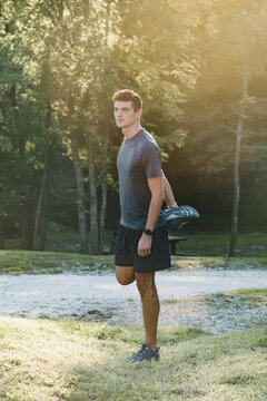 Young Boy Stretching in the Woods