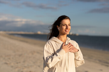 Woman Practices Gratitude During A Sunset