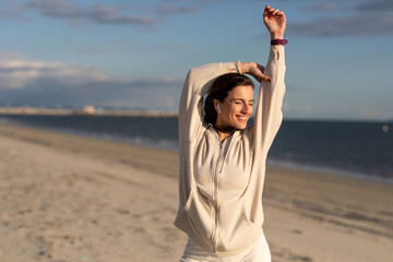 Fototapeta premium Woman Smiles While Stretching