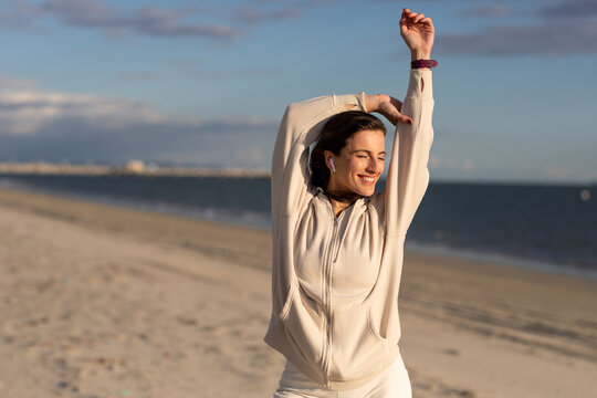 Woman Smiles While Stretching