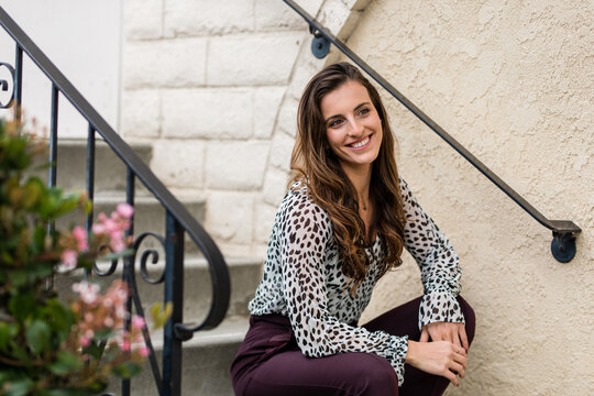 Professional Woman Sits On Steps