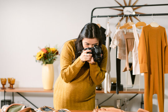 Pregnant Taking Photo Of Fashion Design Clothes