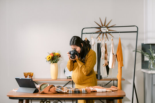 Pregnant Taking Photo Of Fashion Design Clothes