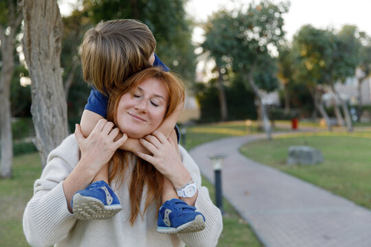 A boy hugging his mom