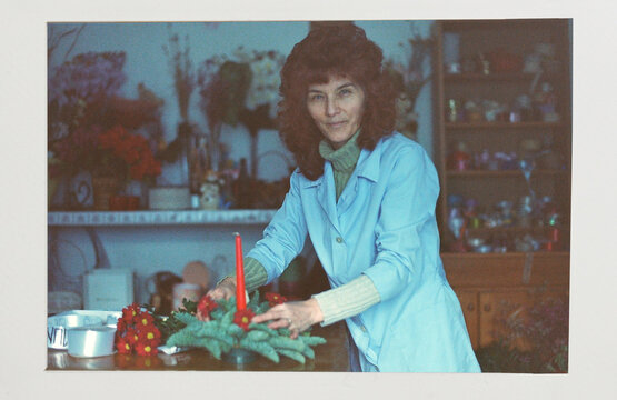 Analog photo of a woman inside her flower shop