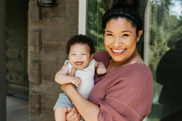 Mother holding her new born son 