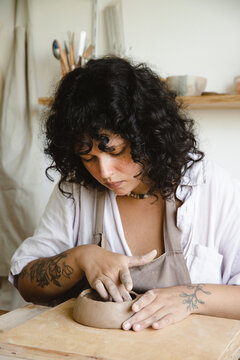 Woman making a ceramic bowl