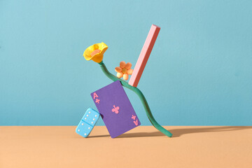 Pink unbranded lipstick balancing on flower and game board