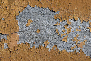 Peeling paint on the wall. Old concrete wall with cracked flaking paint. Weathered rough painted...