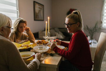 Caucasian family enjoying dinner at home
