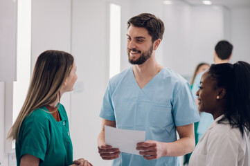 Multiracial team of doctors discussing a patients condition while working in a hospital