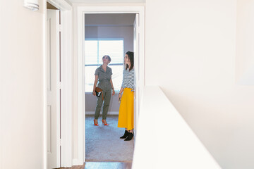 Broker and client inspecting empty home