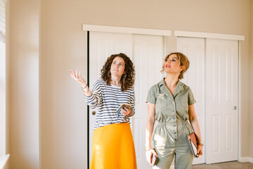 Realtor showing house to broker client