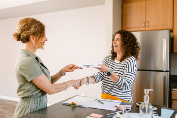 Realtor closing home sale transaction with client