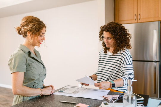 Realtor estates females looking at listings 