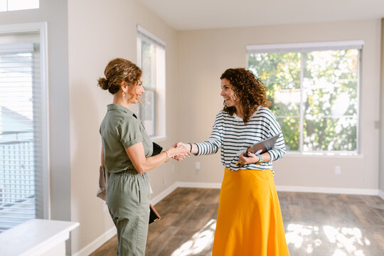 Housing promoter woman formally greeting her client