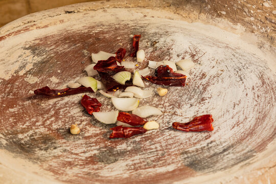 chiles, onion and garlic on a comal