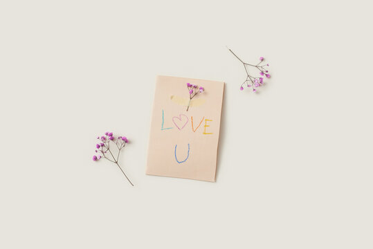 Greeting card with dried flowers and text Love U