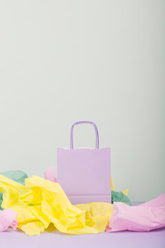 Purple shopping bag with papers