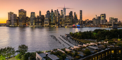 Drone view of Manhattan, New York City and Brooklyn bridge at sunset