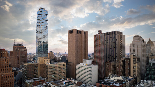 Modern skyscrapers in megapolis of Manhattan at sunset