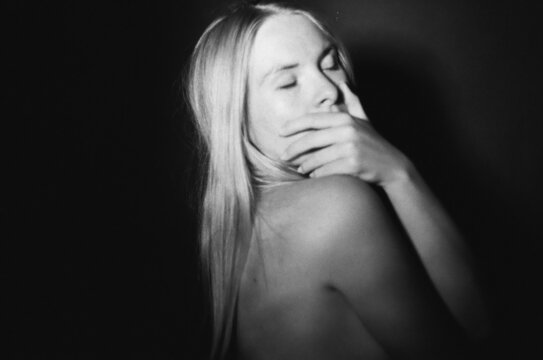 A stressed woman closing her eyes 