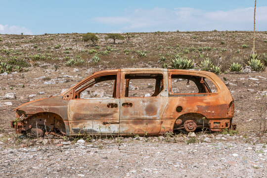 burned truck abandoned on a road