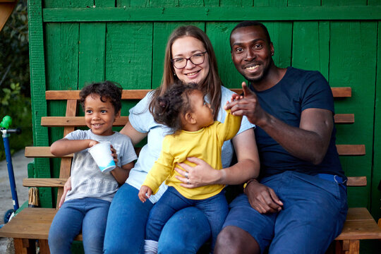 Multiracial family of farmers taking pictures 
