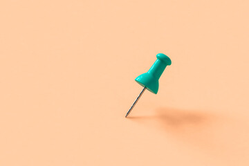 blue push pins on pink background