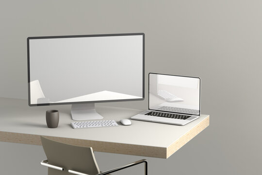 Desktop computer and laptop on top of a desk
