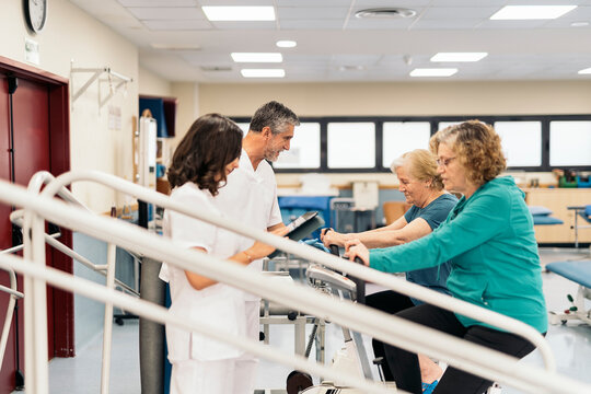 Women on exercise bikes in rehabilitation center
