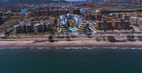 aerial drone shots of the beach city of Lechería, with a residential area of Venice-style stilt...