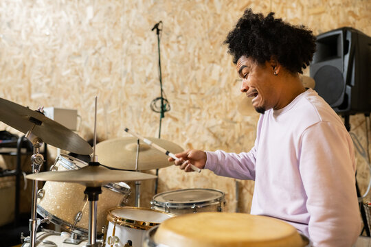 Man With Afro Hair Playing Drums 